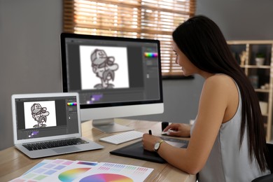Image of Animator working with graphic tablet, computer and laptop. Illustrations on screens
