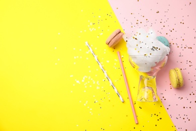 Flat lay composition with sweet cotton candy on color background, space for text