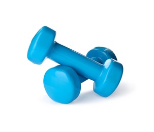 Light blue dumbbells on white background. Weight training equipment