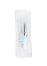 Packed disposable syringe with needle isolated on white, top view