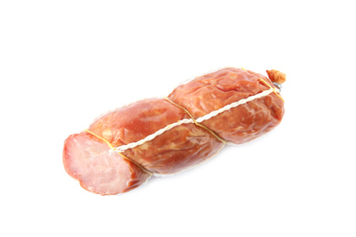 Tasty cut sausage on white background, top view. Meat product