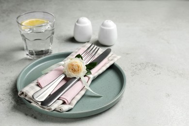 Photo of Beautiful table setting with fabric napkin and rose, space for text