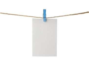 Clothespin with empty notepaper on string against white background. Space for text