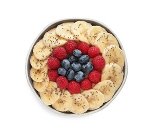 Tasty breakfast with berries, banana and chia seeds in bowl on white background, top view