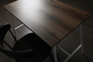 Modern empty wooden table and chair indoors, closeup
