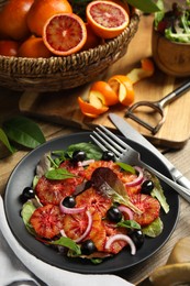 Delicious sicilian orange salad served on wooden table