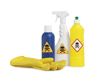 Photo of Bottles of toxic household chemicals with warning signs and gloves on white background