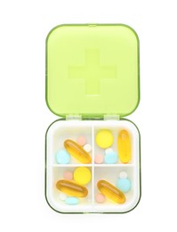 Plastic box with different pills isolated on white, top view