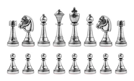Set with silver chess pieces on white background