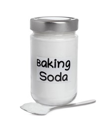 Spoon and jar with baking soda on white background