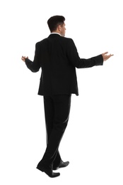 Confused businessman in formal suit on white background, back view
