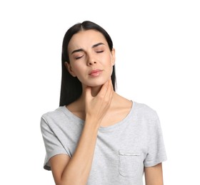 Young woman doing thyroid self examination on white background