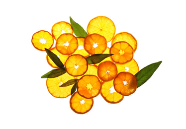 Slices of fresh ripe tangerines and leaves isolated on white, top view. Citrus fruit