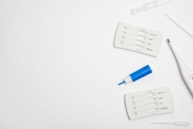 Disposable express hepatitis test kit on white background, flat lay. Space for text