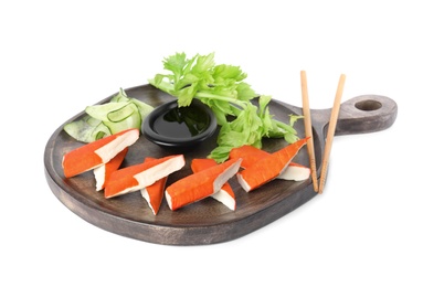 Fresh crab sticks with lettuce and soy sauce on white background