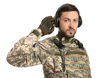 Ukrainian soldier in military uniform and active tactical headphones on white background