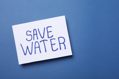 Photo of Card with words Save Water on blue background, top view. Space for text