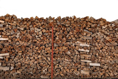 Stacked firewood outdoors. Heating house in winter