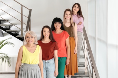 Group of ladies on stairs indoors. Women power