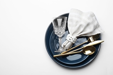 Elegant table setting on white background, top view