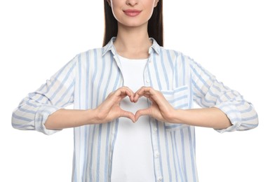 Happy woman showing heart on white background, closeup
