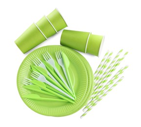 Set of bright disposable tableware on white background, top view