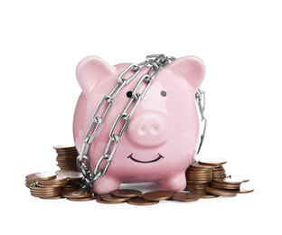 Piggy bank with steel chain and coins isolated on white. Money safety concept