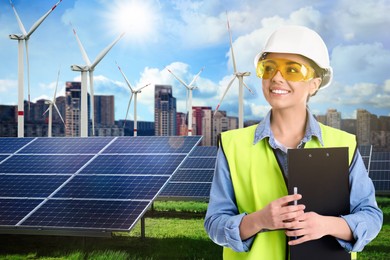 Image of Industrial engineer in uniform and view of solar panels and wind energy turbines installed outdoors