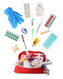 First aid kit. Different medical supplies falling on white background