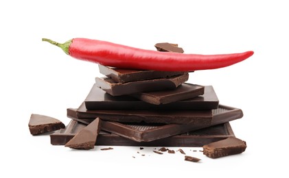 Photo of Red hot chili pepper and pieces of dark chocolate isolated on white