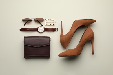 Stylish woman's bag, shoes and accessories on light background, flat lay
