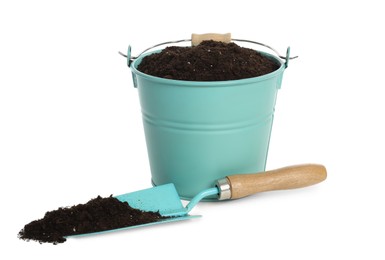 Bucket and shovel with soil on white background. Gardening tool