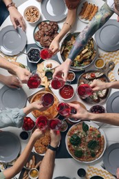 Photo of Group of people having brunch together at table, top view