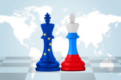 Chess pieces in color of Russian and European Union flags against world map