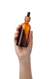Woman holding glass bottle with dropper isolated on white, closeup