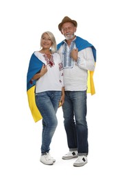Happy mature couple with national flag of Ukraine on white background