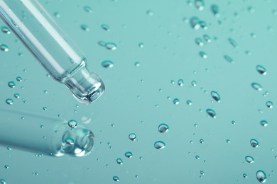Photo of Pipette near serum drops on beautiful mirror, closeup with space for text. Color tone effect