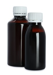 Bottles of cough syrup on white background