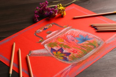 Colorful pastel pencils, flowers and beautiful painting of kettle on wooden table