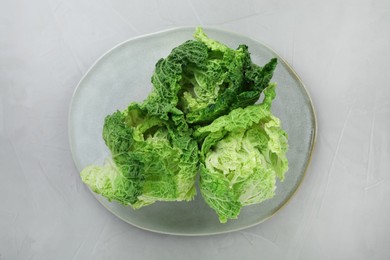 Fresh ripe Chinese cabbages on light grey table, top view