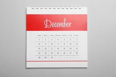 Photo of December calendar on light grey background, top view