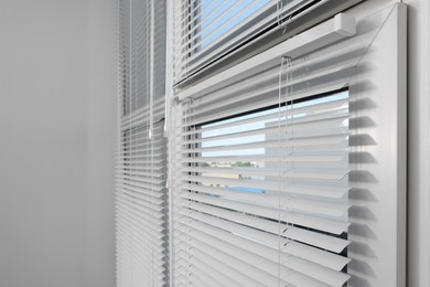 Window with horizontal blinds indoors, space for text