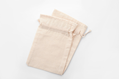 Cotton eco bags isolated on white, top view