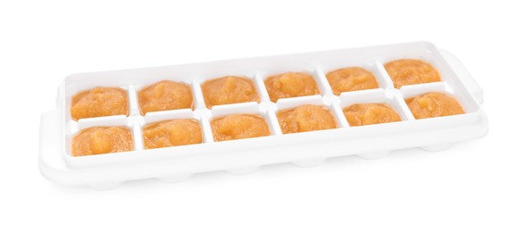 Nectarine puree in ice cube tray isolated on white. Ready for freezing