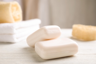 Soap bars on white wooden table indoors. Personal hygiene