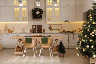 Cozy spacious kitchen decorated for Christmas. Interior design