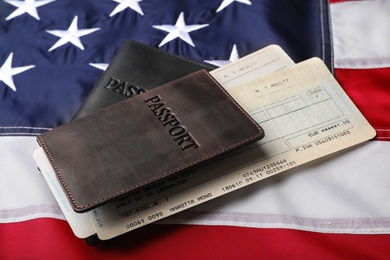 Passports and tickets on flag of USA