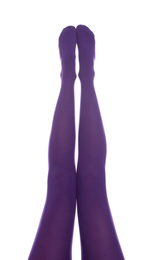 Woman wearing purple tights on white background, closeup of legs