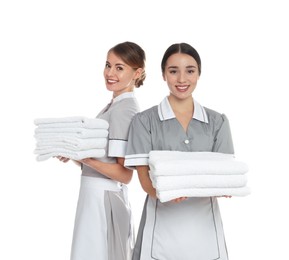 Portrait of chambermaids with towels on white background