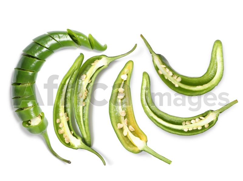 Image of Set with cut green chili peppers on white background, top view 